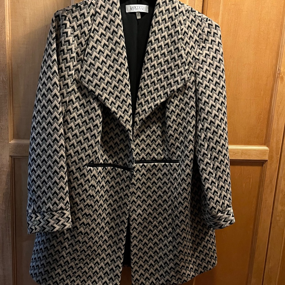 Suit coat. Beautiful. Lightweight. Has some stretch. Worn once. Zipper detail.
